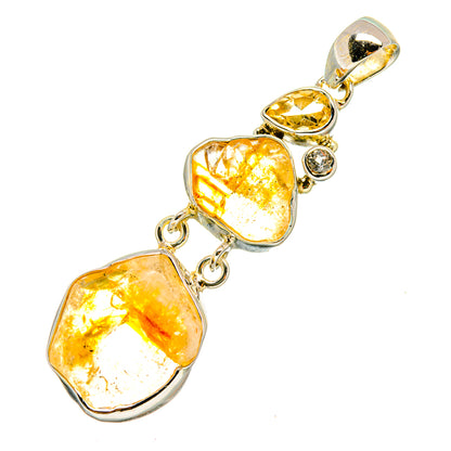Sterling silver citrine pendant with two rough yellow-orange stones, chain links, and round detail