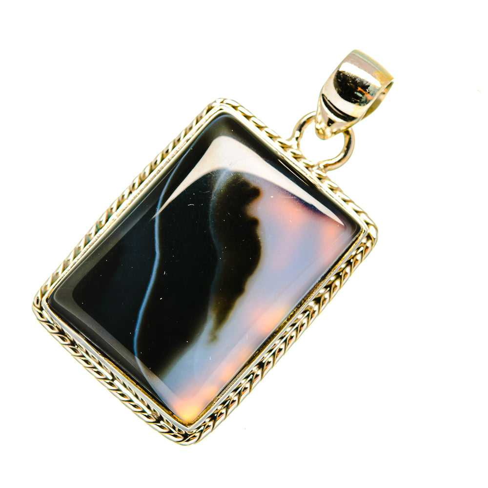 Rectangular banded agate pendant with dark stone, ornate border, and round bail
