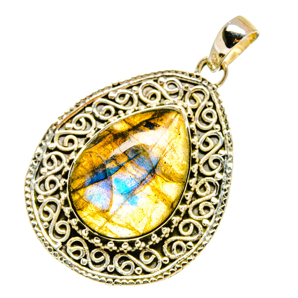 Labradorite pendant in oval filigree sterling silver setting with golden-yellow and blue flash