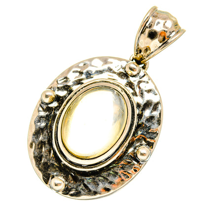 Citrine pendant with oval gold cabochon in textured 925 sterling silver setting