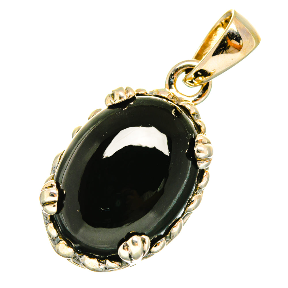 Black onyx oval pendant with bezel and loop bail, sterling silver tone details