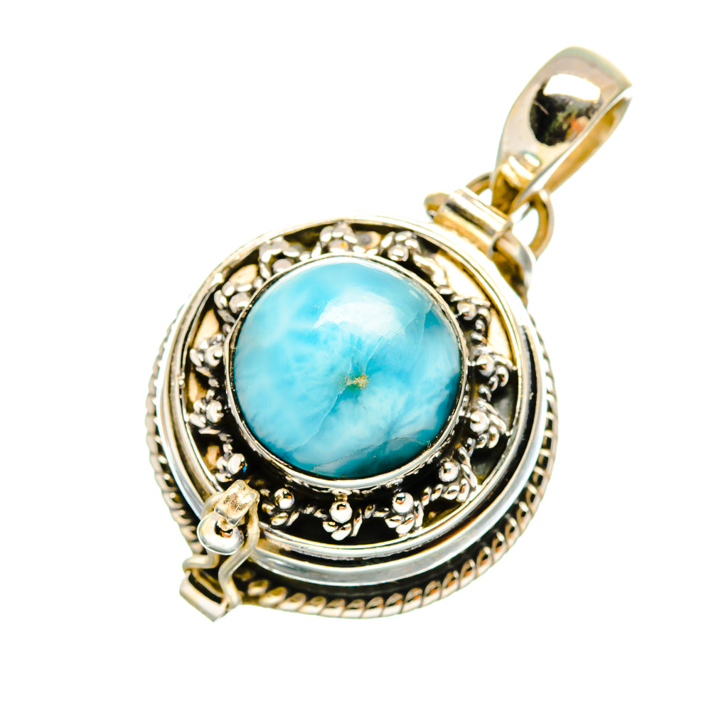 Round blue larimar pendant in ornate sterling silver bezel, bail on top