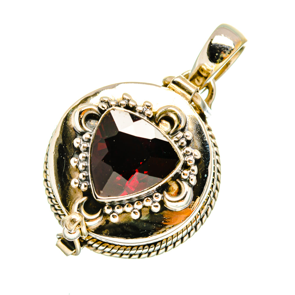 Garnet pendant with dark teardrop gemstone, red highlights, ornate silver bail