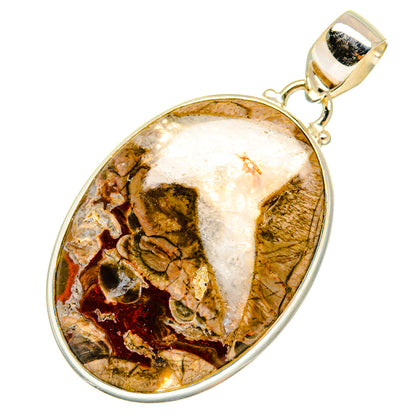 Oval mushroom rhyolite pendant with polished silver frame and bail, veined stone face