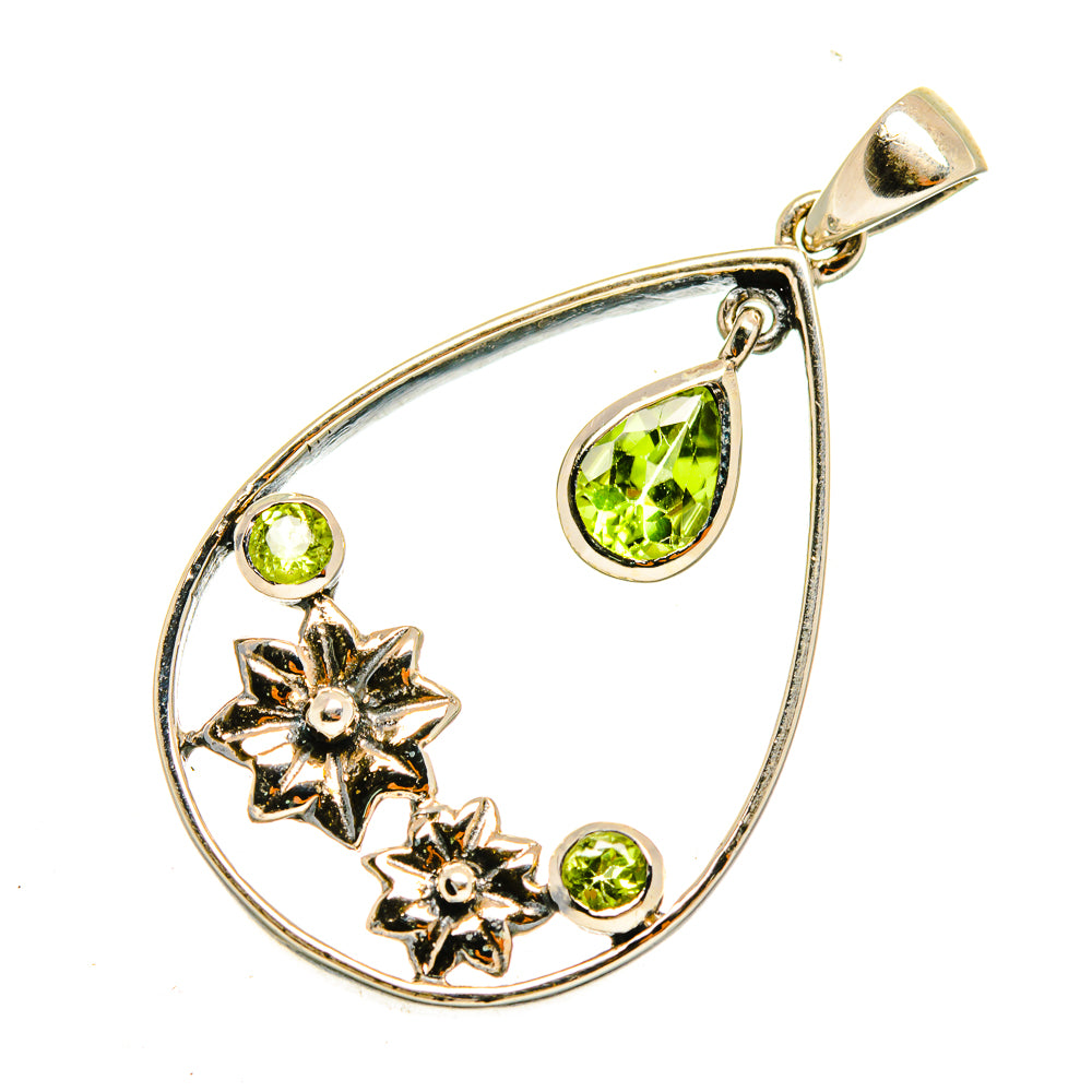 Peridot pendant in teardrop frame with three green stones and two silver flower details