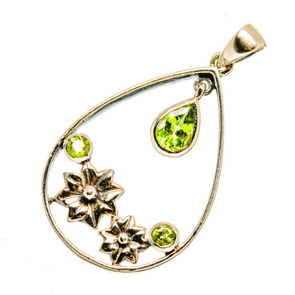 Peridot pendant in teardrop frame with three green stones and two silver flower details