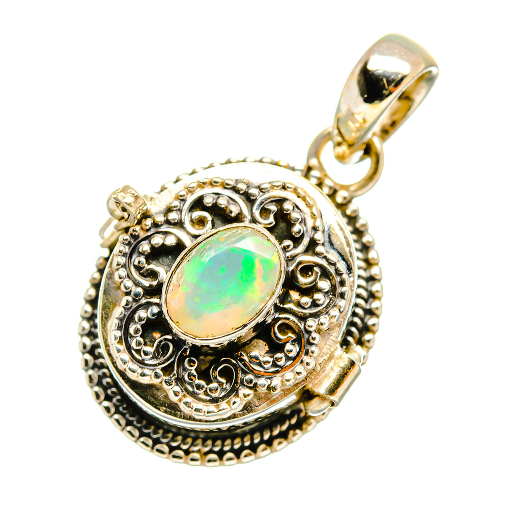 Round opal pendant with silver border and scrollwork, green opal cabochon, bail.