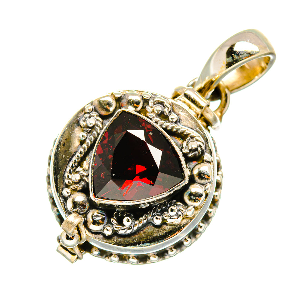 Oval garnet pendant in sterling silver with red faceted stone and loop bail