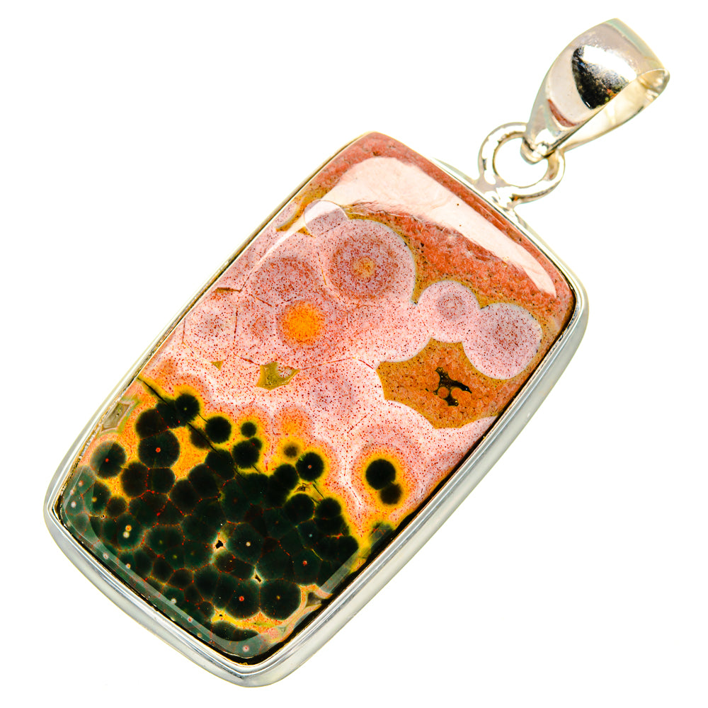 Rectangular ocean jasper pendant, silver framing and bail over orange pink and green pattern