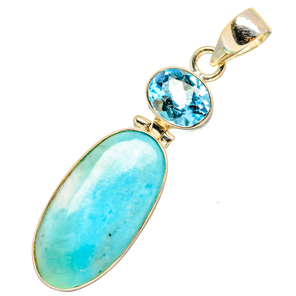 Silver pendant with oval turquoise Larimar and round blue topaz stones, top loop bail