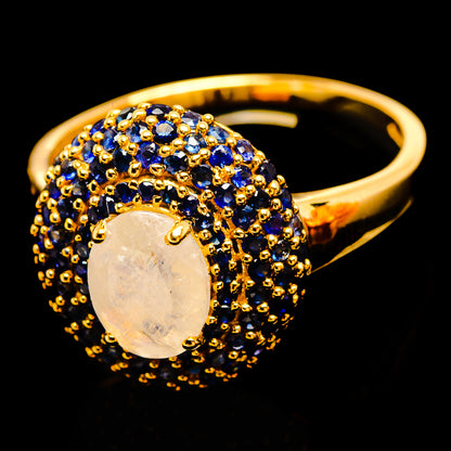 14K yellow gold ring with oval opal-like moonstone, blue sapphire halo and band
