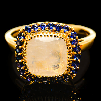 14K yellow gold ring with oval moonstone and blue sapphire halo, size 8