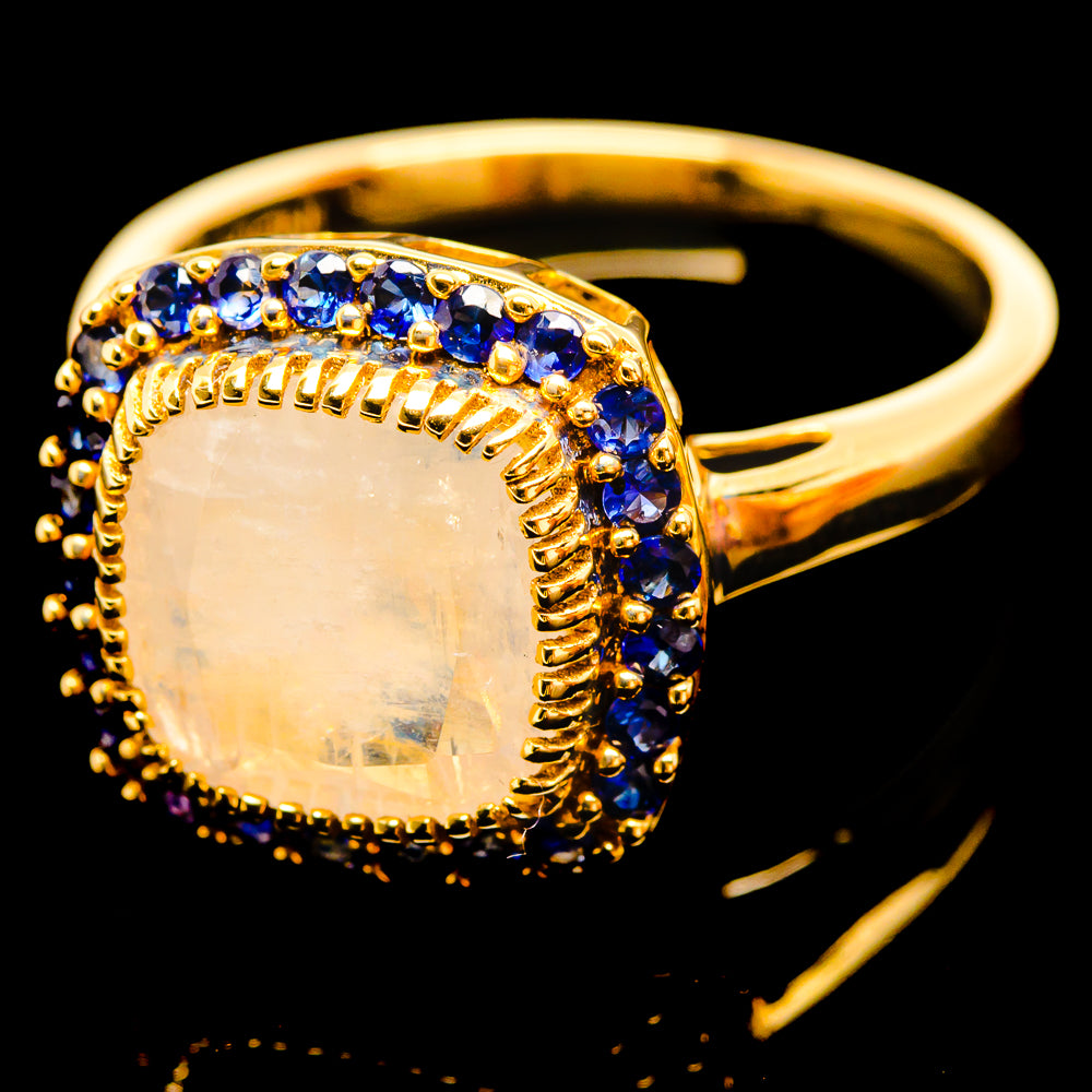 14K yellow gold side-view ring with oval moonstone bezel and blue sapphire band