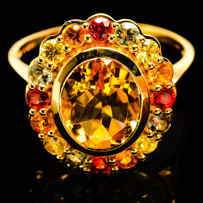 14K yellow gold ring with oval citrine center and red, green, yellow gem halo