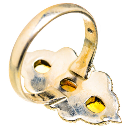 Close view of sterling silver opal ring band underside with three prong mounts.