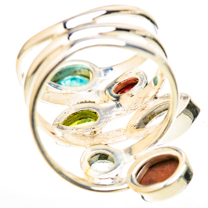 Sterling silver multi-stone ring with teal, green and brown oval settings at angle
