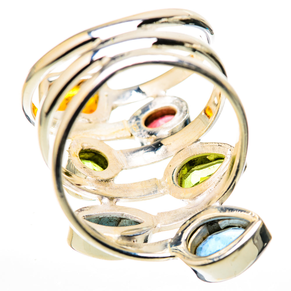 Sterling silver ring side view with prong-set blue and green gemstones and openwork