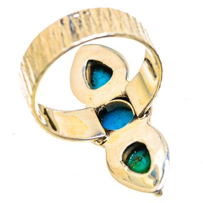 Turquoise triple-stone ring with metallic setting, underside view of band
