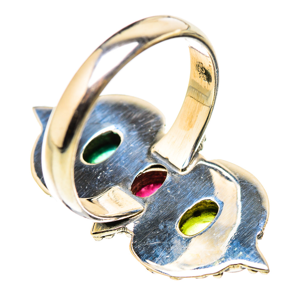 Sterling silver ring with openwork panels and oval green, pink, and teal stones