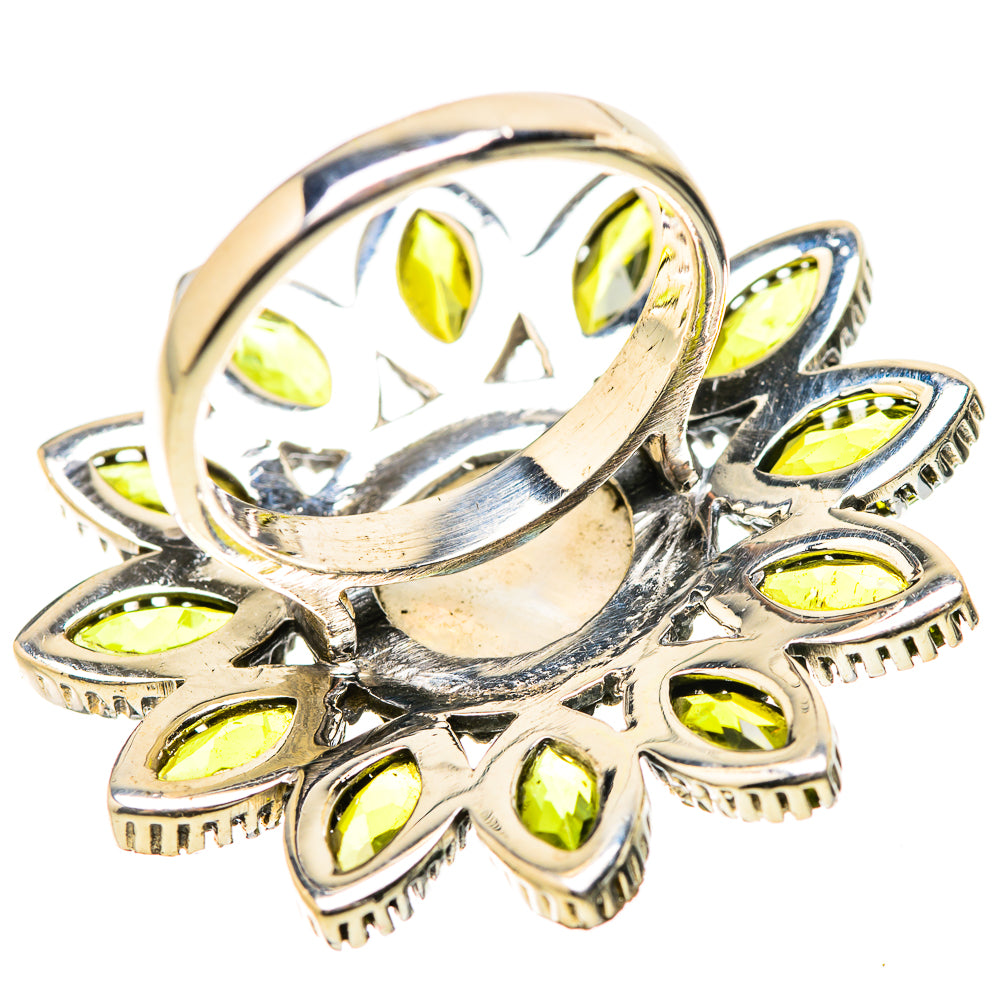 Sterling silver top of ring with round white opal center and yellow-green marquise stones