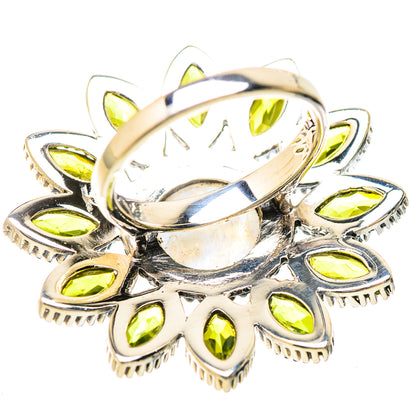Sterling silver peridot moonstone ring with raised bezel and yellow-green side stones