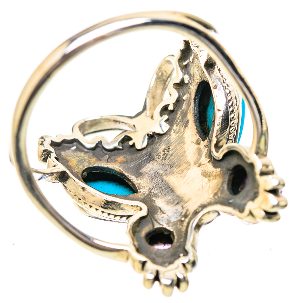 Silver-tone skull ring underside view with turquoise inlay and clawlike details