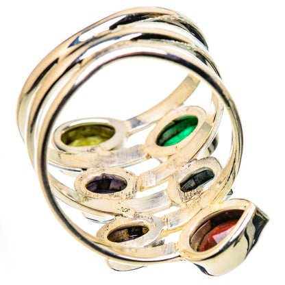Sterling silver ring underside with green, purple, blue, black, and red stone settings