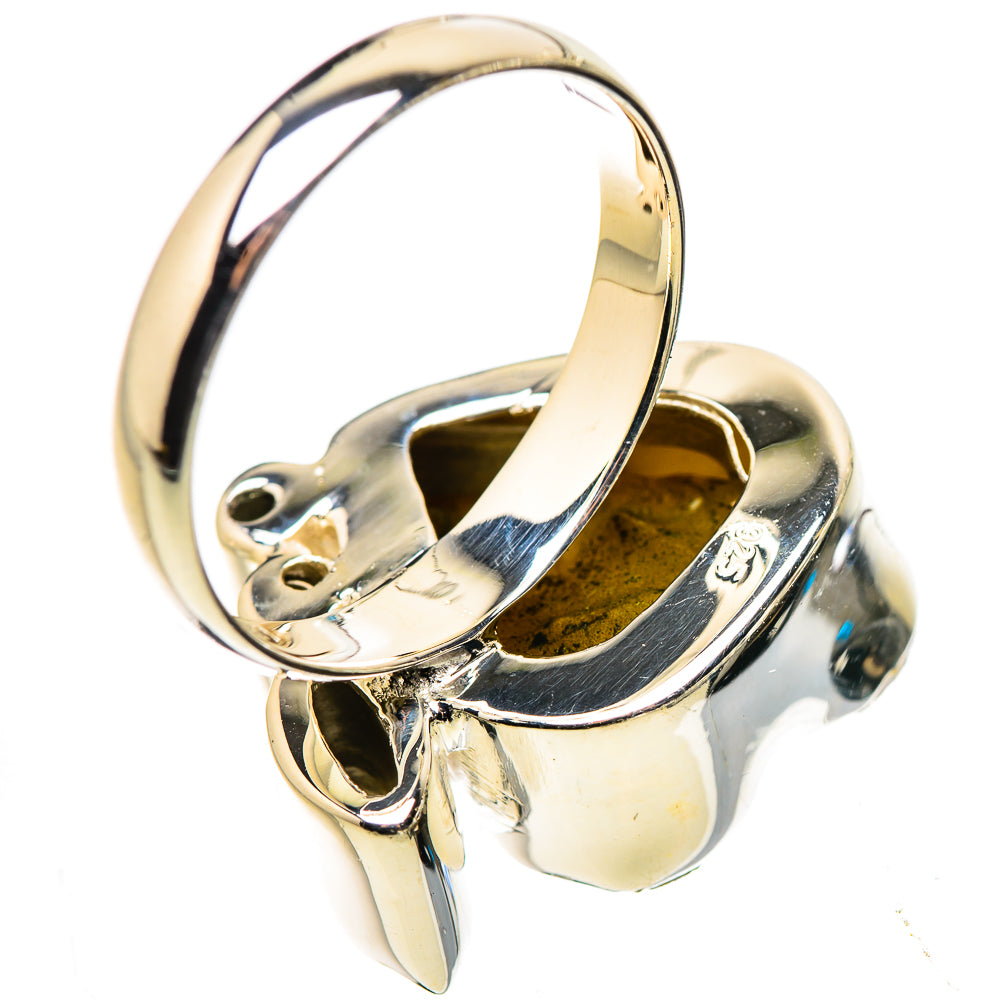 Sterling silver ring band with interior setting and metal prongs holding stones