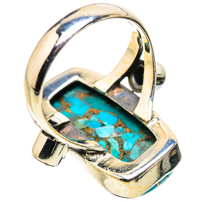 Oval turquoise cabochon ring in sterling silver bezel, blue stone with gold matrix.