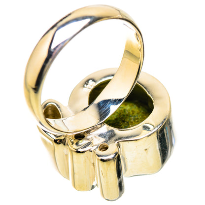 Sterling silver ring band with prongs and green peridot stone under the top setting