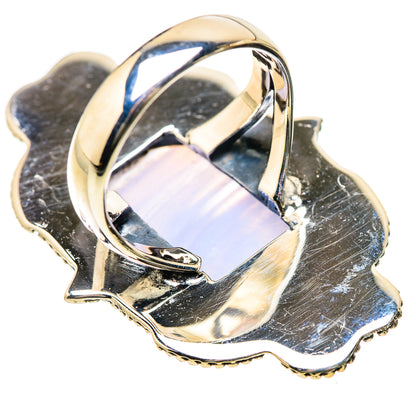 Silver ring with rectangular iridescent stone and raised bezel setting