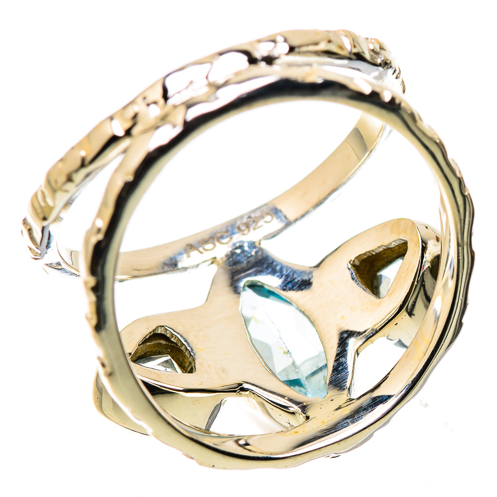 Polished sterling silver ring band with blue topaz setting and engraved interior