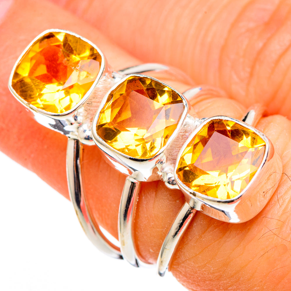 Sterling silver citrine ring featuring three oval faceted yellow stones on a slim shank