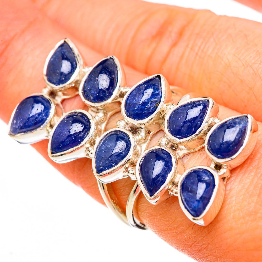 Gold-toned ring with marquise blue kyanite-style gemstones in a clustered setting