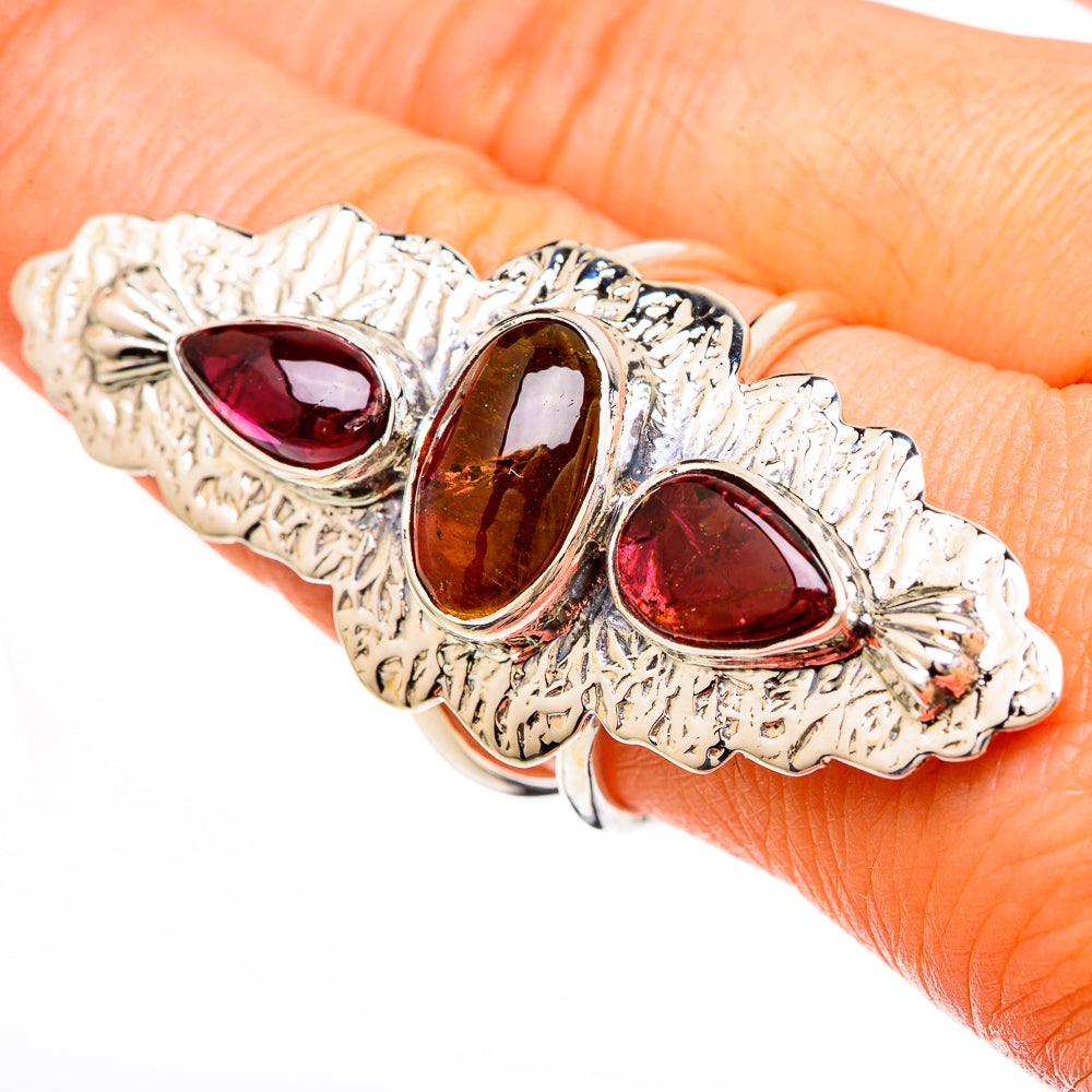 Sterling silver statement ring with three oval pink, brown, and red gemstones