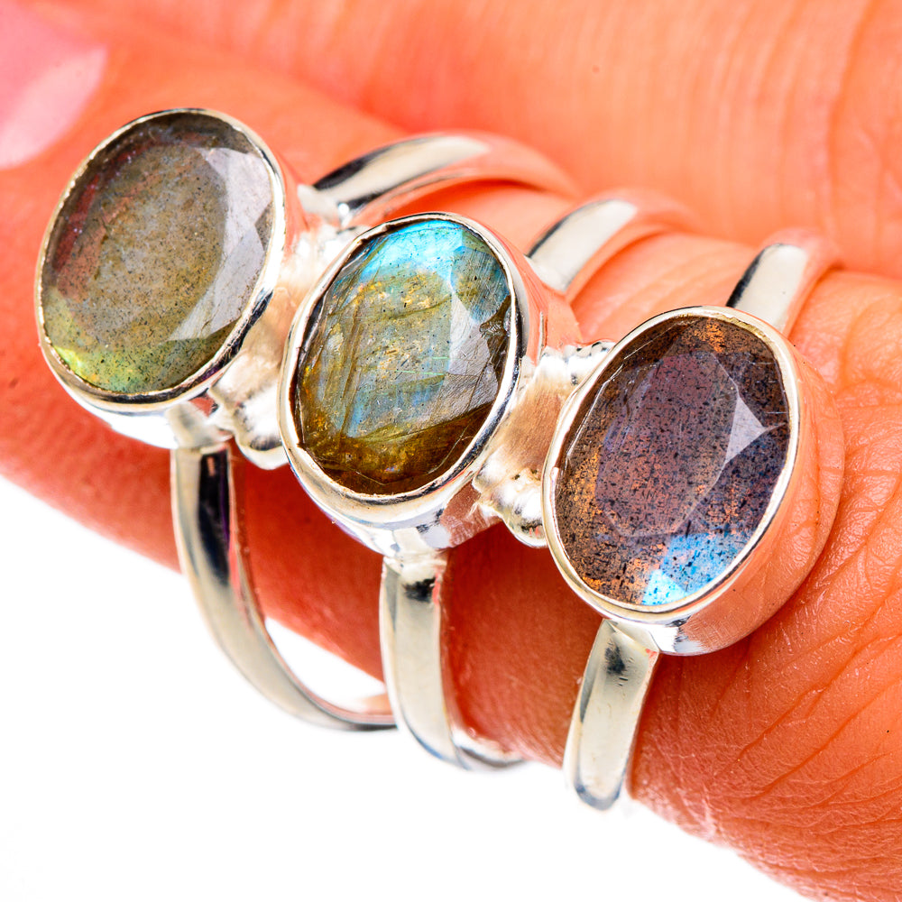 Sterling silver triple-oval gemstone ring with blue, green-gold, and dark gray stones