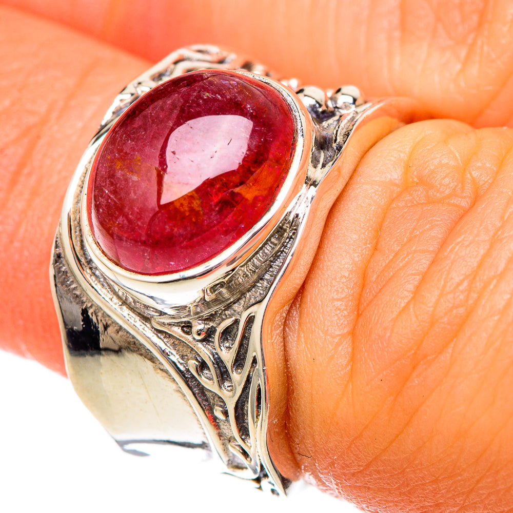 Silver-tone oval pink tourmaline cabochon ring with engraved bezel and side patterns
