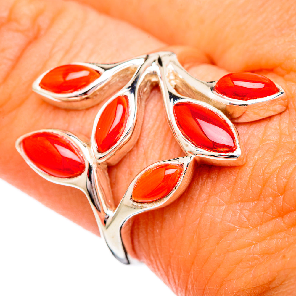 Sterling silver ring close-up with marquise red coral-like cabochons and prongs