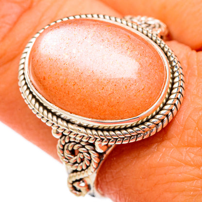 Sunstone oval cabochon sterling silver ring, rope bezel detail on orange gem face