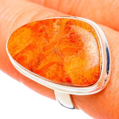 Sterling silver ring with oval orange-red sponge coral cabochon in bezel setting