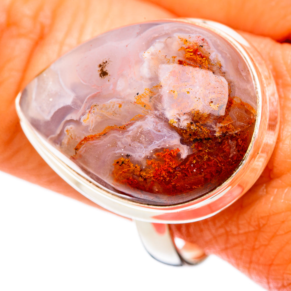 Silver-tone oval ocean jasper cabochon ring with white, amber, and rust swirls.