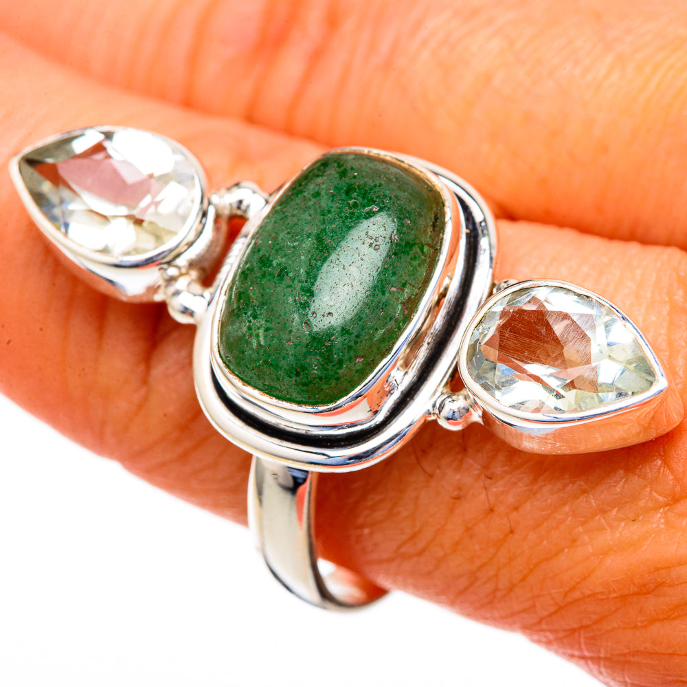 Sterling silver ring with green oval center stone and two faceted clear teardrop stones