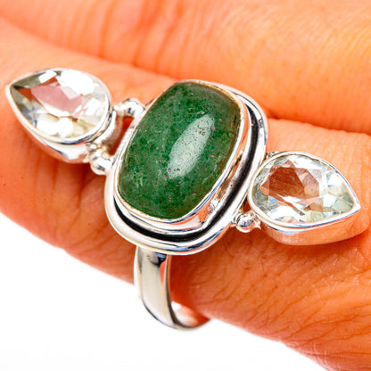 Sterling silver ring with green oval center stone and two faceted clear teardrop stones