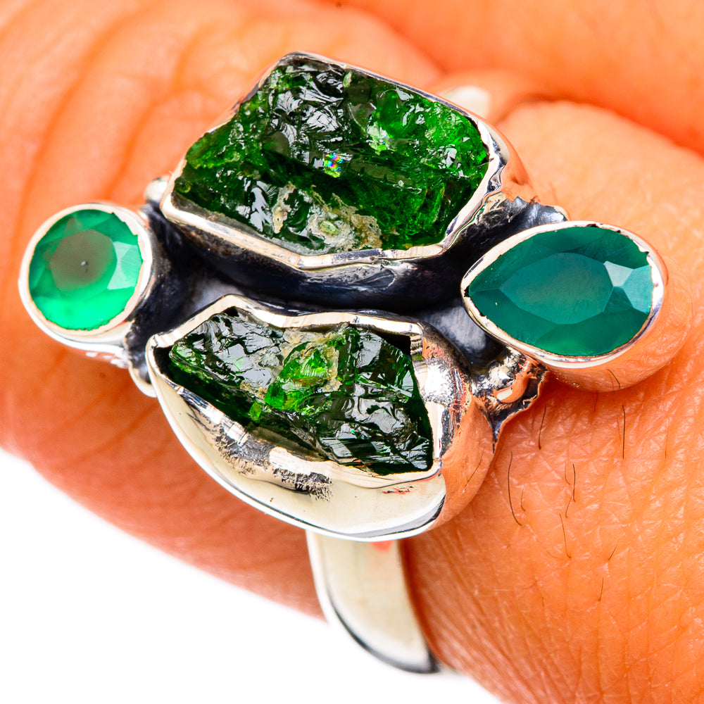 925 sterling silver ring with three green oval and rectangular faceted stones on finger
