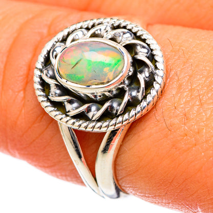 Sterling silver opal ring with oval cabochon and braided edge details, size 8.5