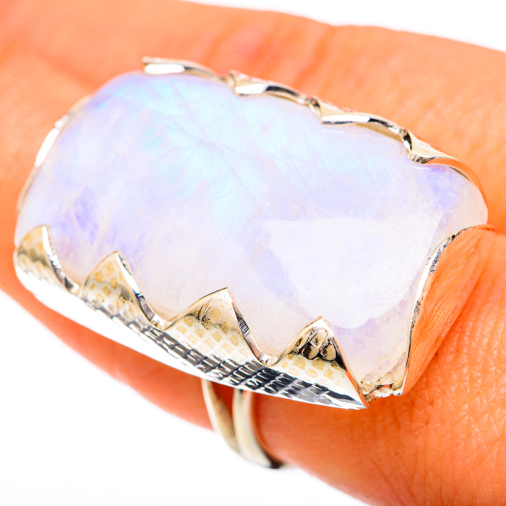 Opalescent moonstone ring with faceted heart-like top, sterling silver band