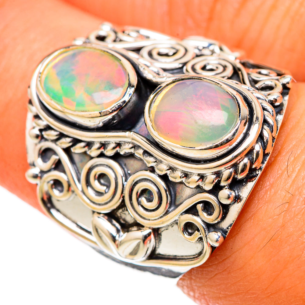 Sterling silver opal ring with two oval Ethiopian opal cabochons and ornate filigree