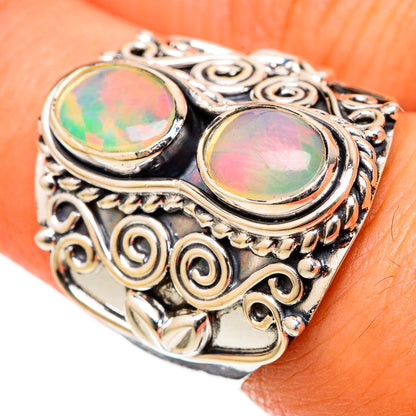 Sterling silver opal ring with two oval Ethiopian opal cabochons and ornate filigree