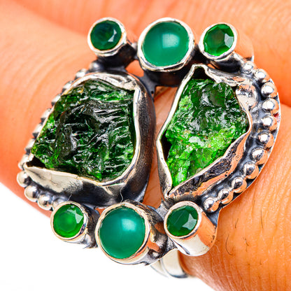 Green gemstone ring with rough green center, bezel-set round stones, silver halo setting