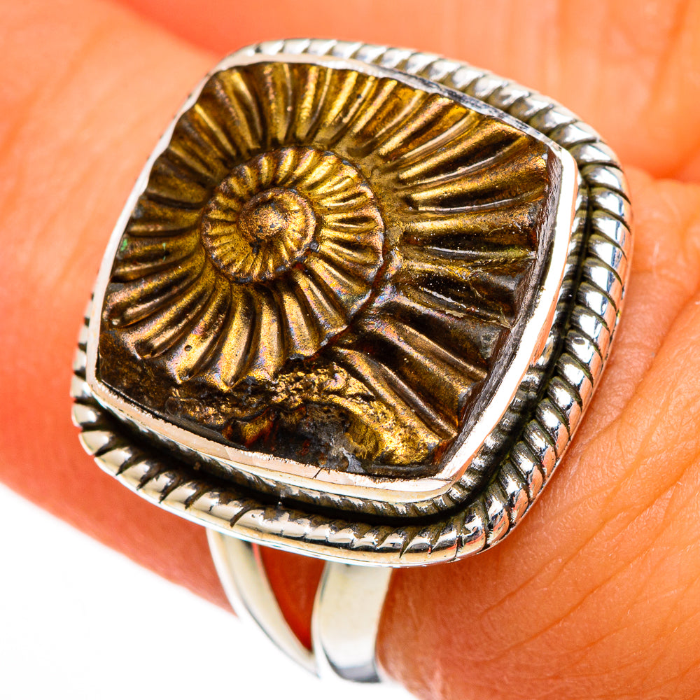 Sterling silver ring with gold pyrite spiral cabochon, raised bezel on finger